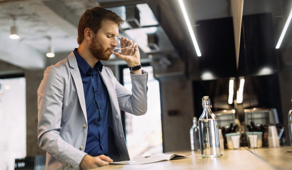 businessman drinking water