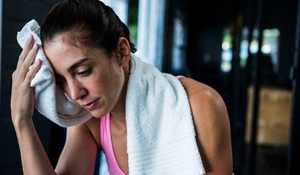 Female athlete wiping sweat ee220330