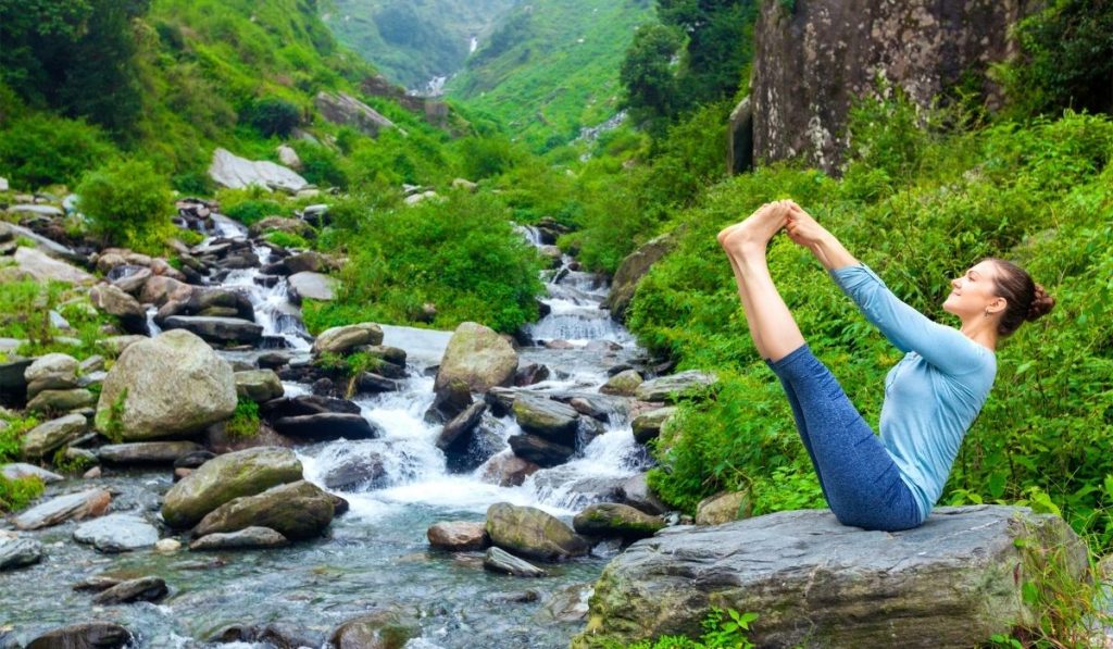 calm woman doing Ashtanga Yoga outdoors - ee220401