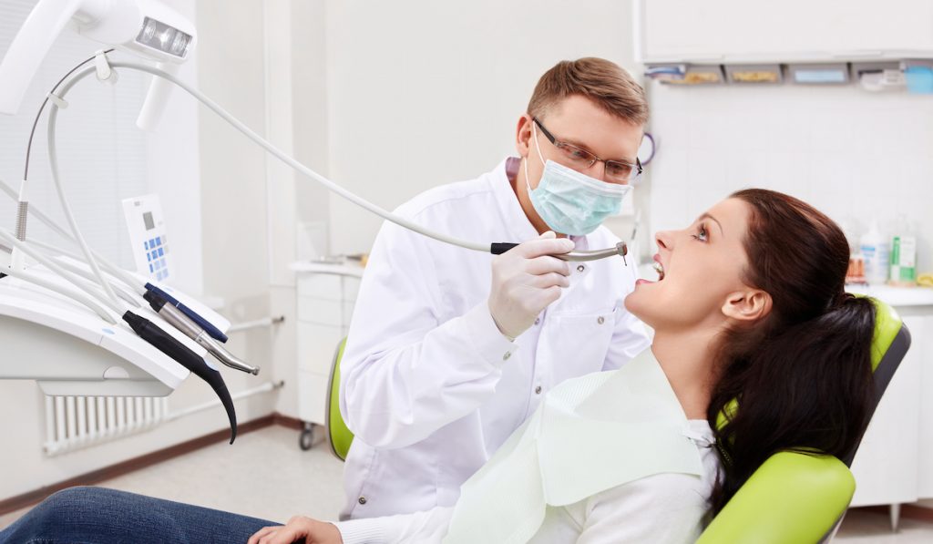 dentist treats patient