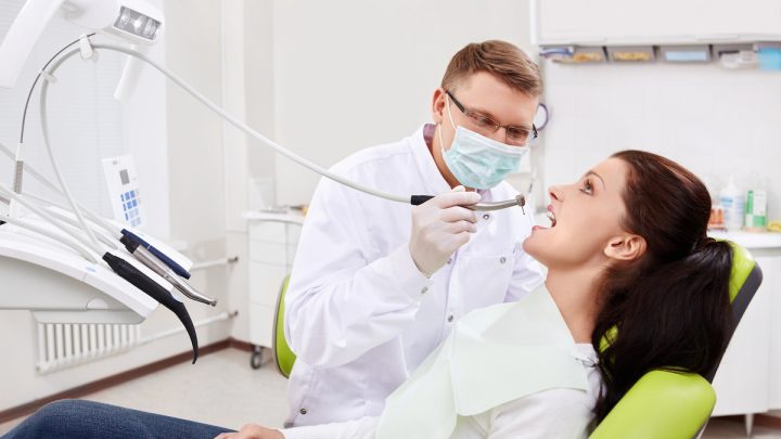 dentist treats patient