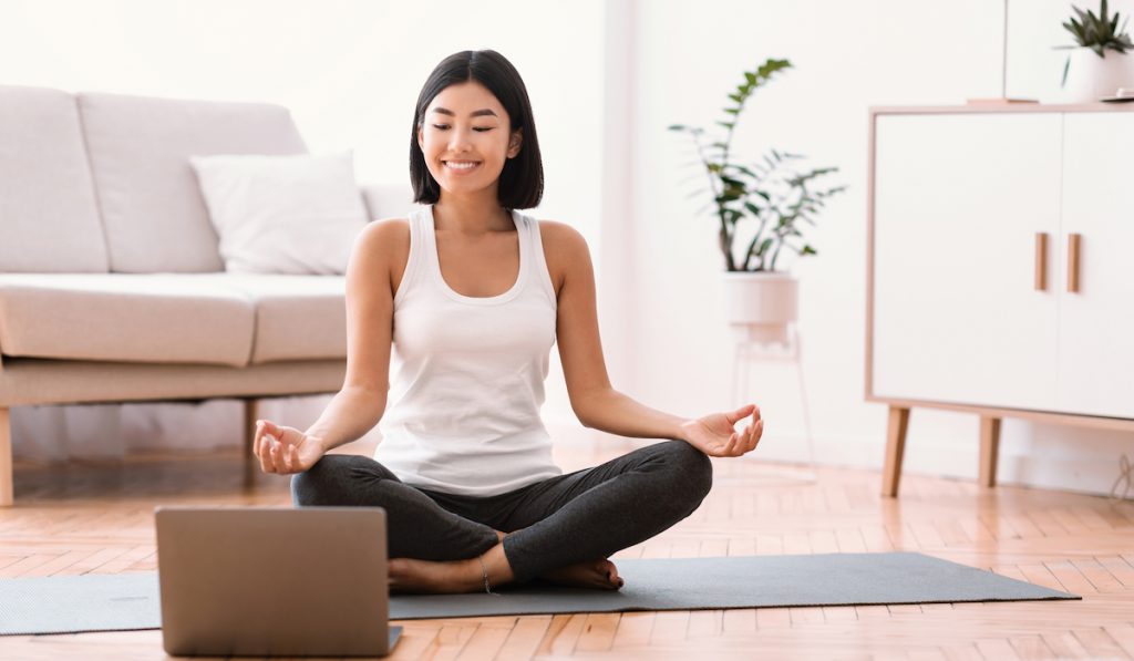 woman happily meditating