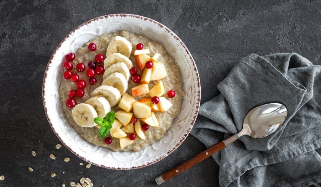 prepared breakfast oatmeal with fruit toppings