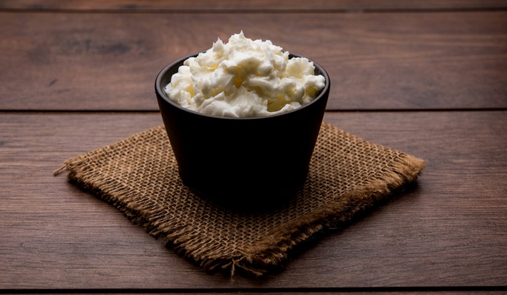 shea butter in a bowl on a burlap