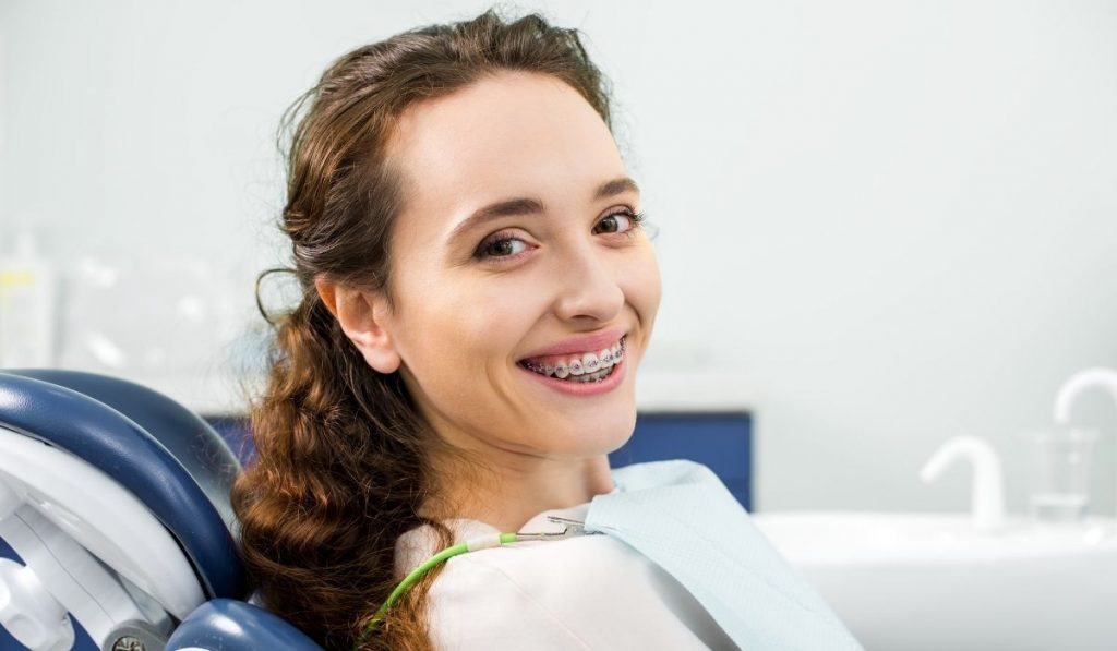 woman with braces in dental clinic - ee220324